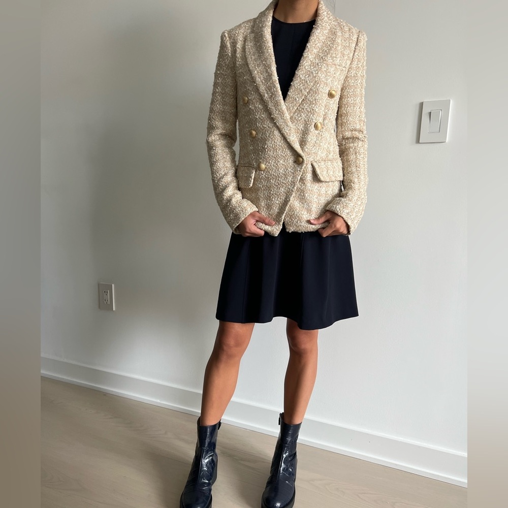 L’Agence white and beige double-breasted blazer.